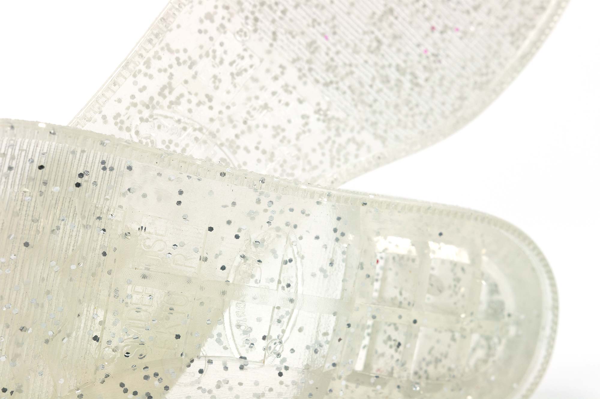 Poudre glitter incluse dans une matière plastique